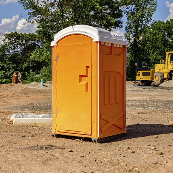 what is the cost difference between standard and deluxe portable restroom rentals in Auxier